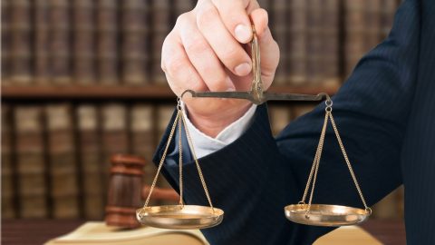 Holding scales of justice
