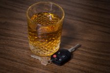 Alcoholic drink beside car keys