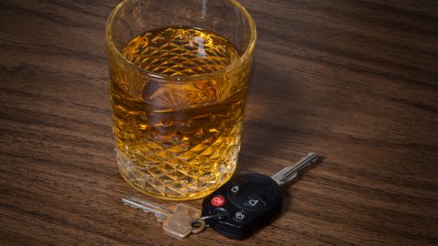 Alcoholic drink beside car keys