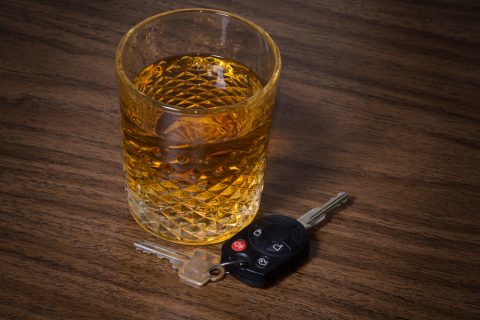Alcoholic drink beside car keys