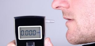 Man using breath tester machine