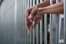 Woman in a prison cell