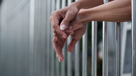 Woman in a prison cell