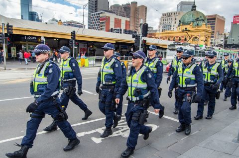 Australian police crossing the road