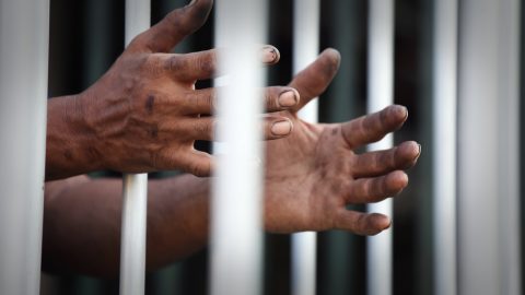 Black man in jail cell
