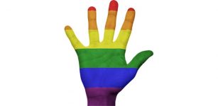 Gay symbol on left hand
