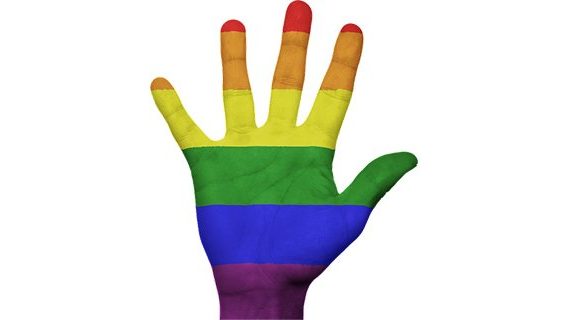 Gay symbol on left hand