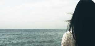 Woman by the sea water