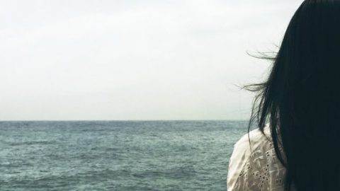 Woman by the sea water