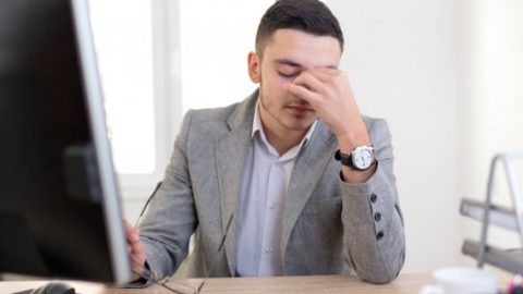 Male employee stressed at work
