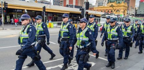 Police in Australia crossing road