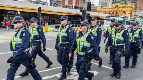 Police in Australia crossing road