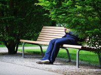 Hidden identity man sitting on bench