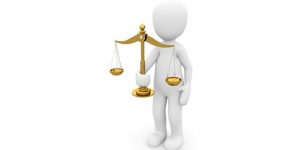 Justice scale held by figure