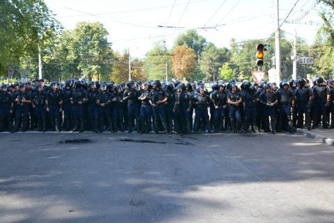 Police officers surround street
