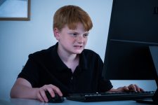 Boy angry while on his computer