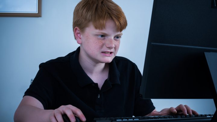 Boy angry while on his computer