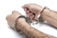 Handcuffs on wrists