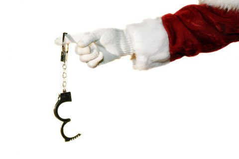 Santa holding handcuffs