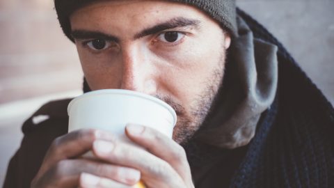 Homeless man drinking