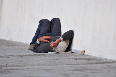 Homeless man laying down