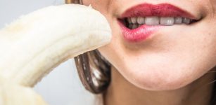 Girl holding a banana