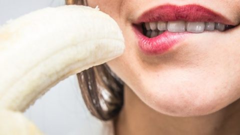 Girl holding a banana