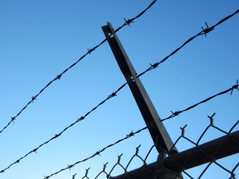 barbed wire on prison fence