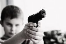 Boy holding a gun