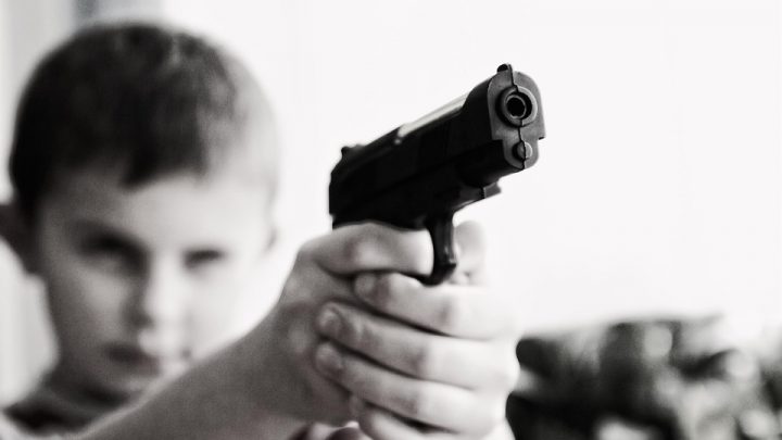 Boy holding a gun