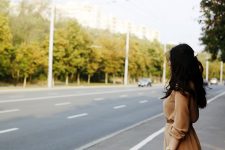 Female waiting by a road