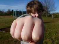 Boy throwing punch