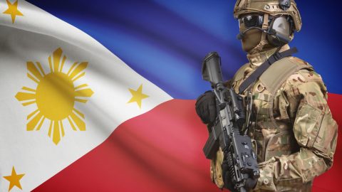 Filipino flag and soldier