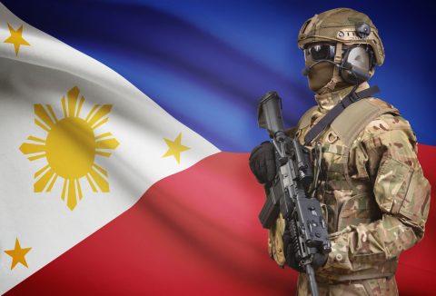 Filipino flag and soldier