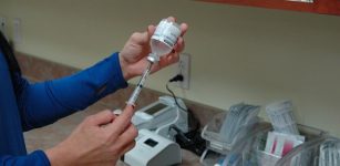 Nurse preparing a syringe