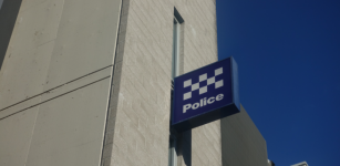 Police station sign on building