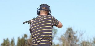 Man holding gun at shooting range