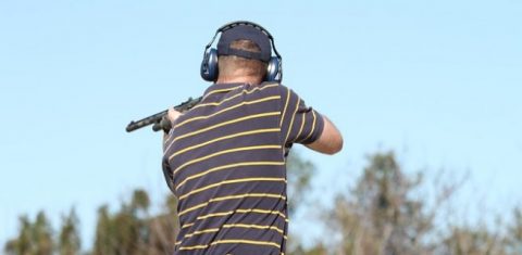 Man holding gun at shooting range