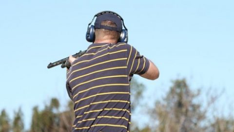 Man holding gun at shooting range