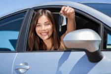 Young girl holding car keys