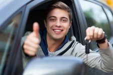 Young male driver doing a thumbs up