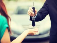 Traffic lawyer giving back client her car keys