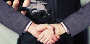 Handshake agreement and a pointed gun