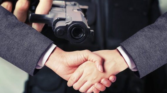 Handshake agreement and a pointed gun