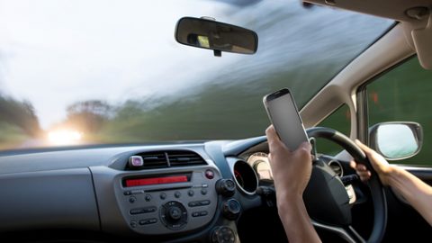 Texting with mobile phone while driving