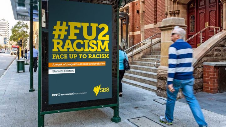 Face up to racism advert on bus stop