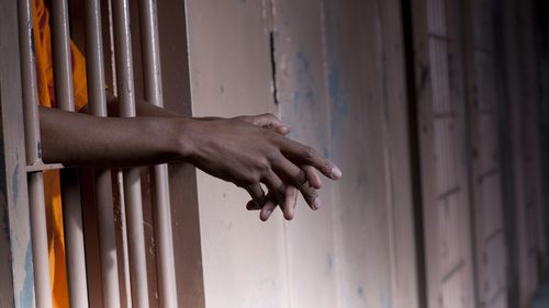 Aboriginal detained in a cell