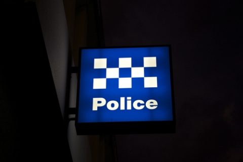 Police station sign at night