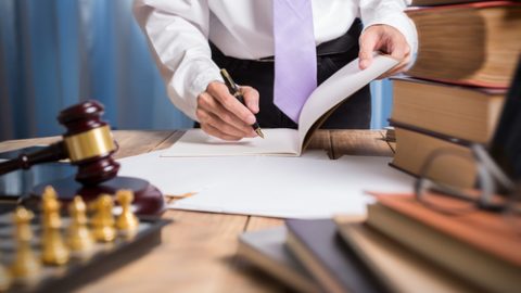 Lawyer wearing a tie and reading books