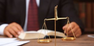 Lawyer at his desk with scales